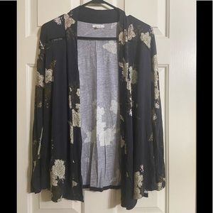 Navy blue Top with cream colored flowers.